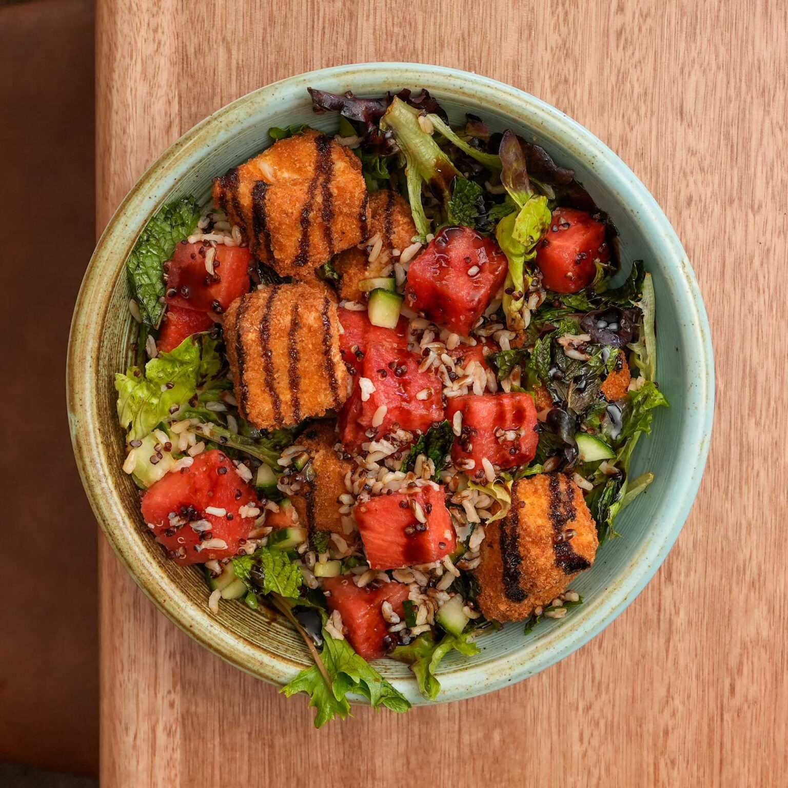 Fried Ricotta & Watermelon Salad | Cucumber, Lettuce, Quinoa, Vinaigrette, Balsamic Glaze | $24